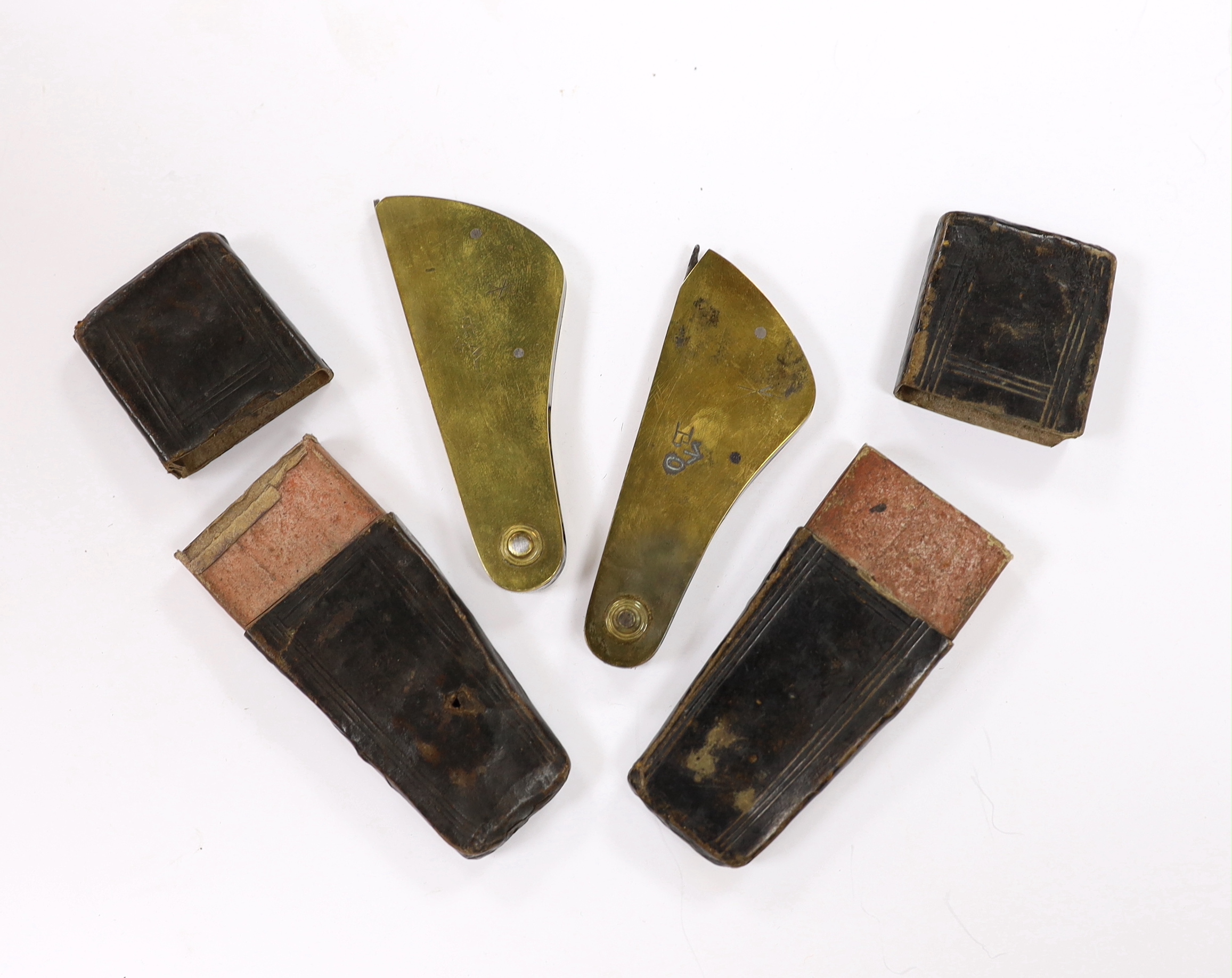 Two Georgian leather cased brass and steel fleams, one stamped ‘W&H Hutchinson Sheffield’ and the other ‘Morton & Foster’, both engraved with early military broad arrow, cases 11cm
